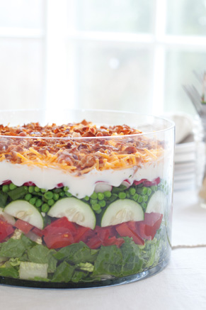 Layered salad in plastic cups. Perfect for picnics