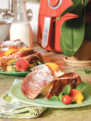 https://cdn.pauladeen.com/wp-content/uploads/2020/05/31074901/airfryer_peachesandcreamstuffedfrenchtoast.png